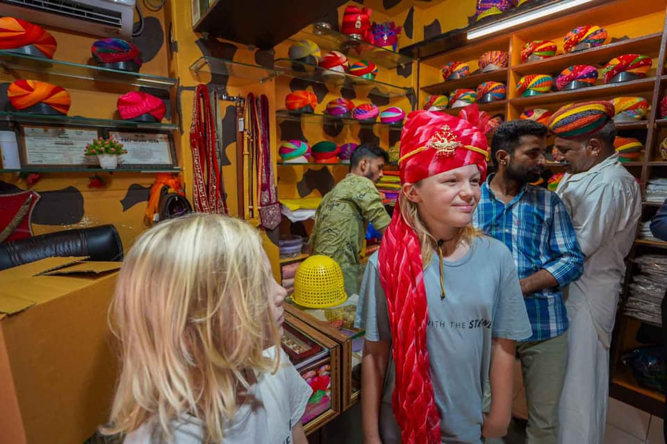 Trying on a turban in the desert of Rajasthan. 