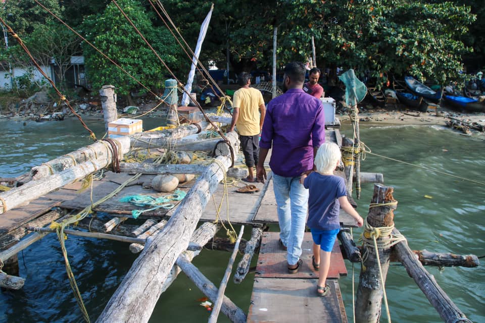 Walking out to the Chinese Fishing Nets with our guide things to do in Kochi. 