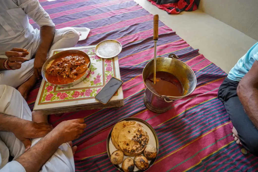 Bati rolls on a platter with Chapati.
