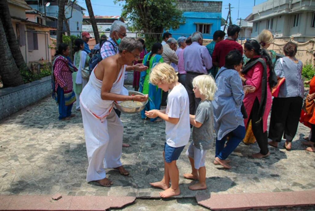 Feeding the pigeons things to do in Kochi with kids.