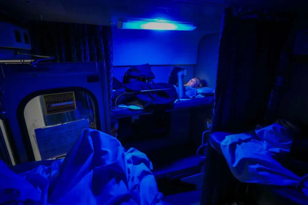 Tucked up in bed in 2-Tier AC Second Class (2A) on board the Mewar Express train Delhi to Udaipur.