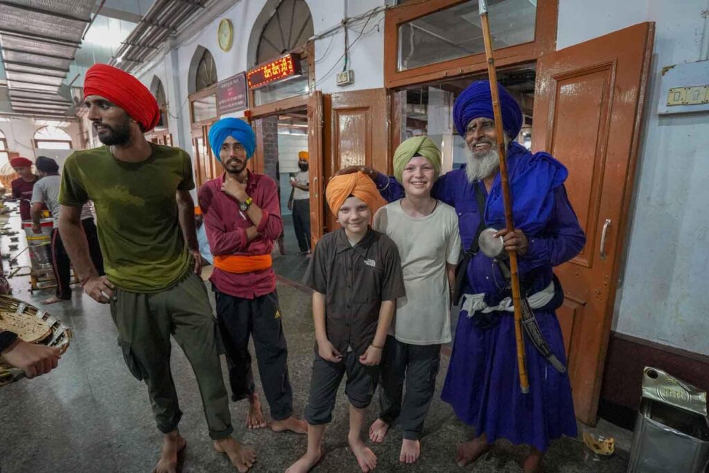 Travelling India with kids visiting the Golden Temple in Amritsar. 