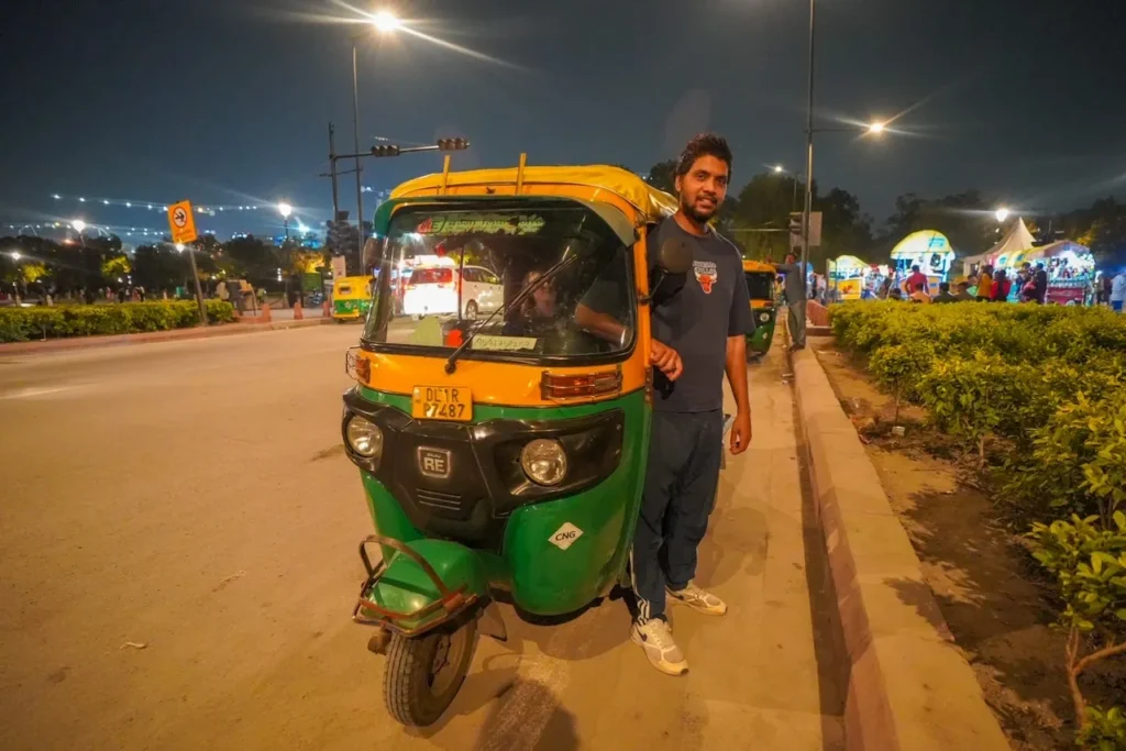 Driver Sunny waiting patiently outside the busy India Gate in Delhi.