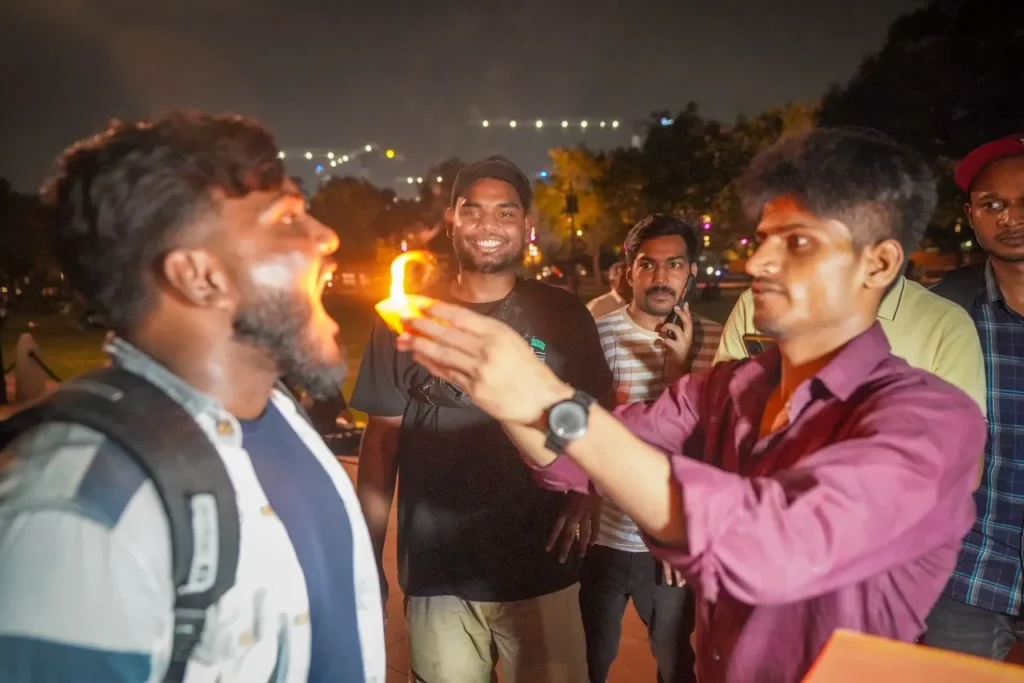 Crowds gathering for fire paan outside India Gate in Delhi.